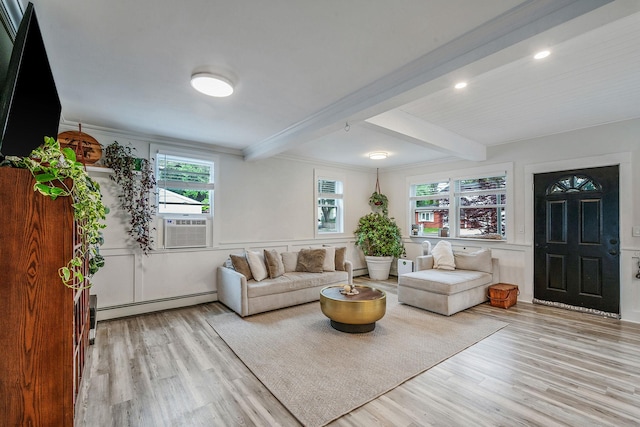 29 Montauk St, Selden, NY 11784 - living area featuring a baseboard radiator, beam ceiling, wood finished floors, crown molding, and cooling unit