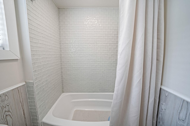 29 Montauk St, Selden, NY 11784 - bathroom featuring wainscoting and shower / tub combo with curtain