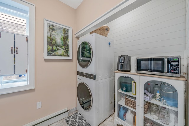 29 Montauk St, Selden, NY 11784 - washroom featuring stacked washer and clothes dryer and baseboard heating