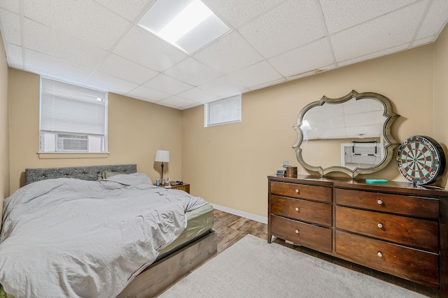 29 Montauk St, Selden, NY 11784 - bedroom with a drop ceiling, wood finished floors, and baseboards