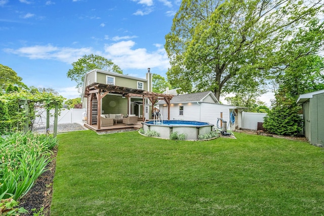 29 Montauk St, Selden, NY 11784 - back of property with a pergola, an outdoor hangout area, and an outdoor pool