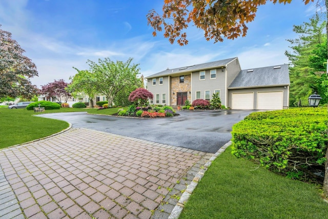 8 Victor Ln, Woodbury, NY 11797 - colonial inspired home featuring asphalt driveway, a front yard, and a garage