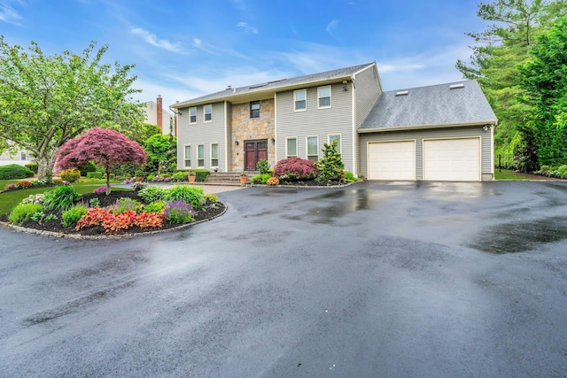 8 Victor Ln, Woodbury, NY 11797 - view of front of property featuring asphalt driveway, a garage, and stone siding