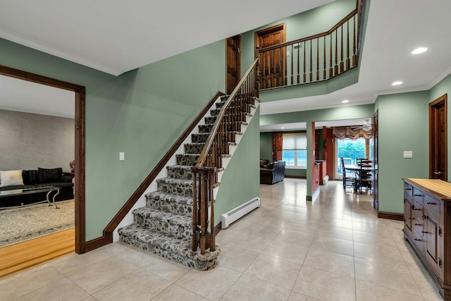 8 Victor Ln, Woodbury, NY 11797 - stairway featuring a baseboard heating unit, tile patterned floors, baseboards, recessed lighting, and crown molding