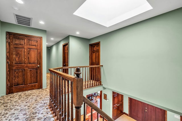 8 Victor Ln, Woodbury, NY 11797 - hall with an upstairs landing, recessed lighting, a skylight, baseboards, and light colored carpet