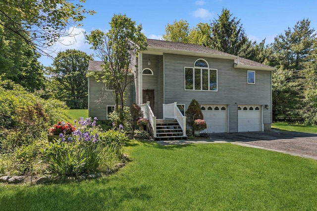 312 Diddell Rd, Poughkeepsie, NY 12603 - view of front of house featuring driveway, an attached garage, and a front lawn