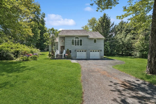 312 Diddell Rd, Poughkeepsie, NY 12603 - bi-level home featuring a garage, asphalt driveway, and a front lawn