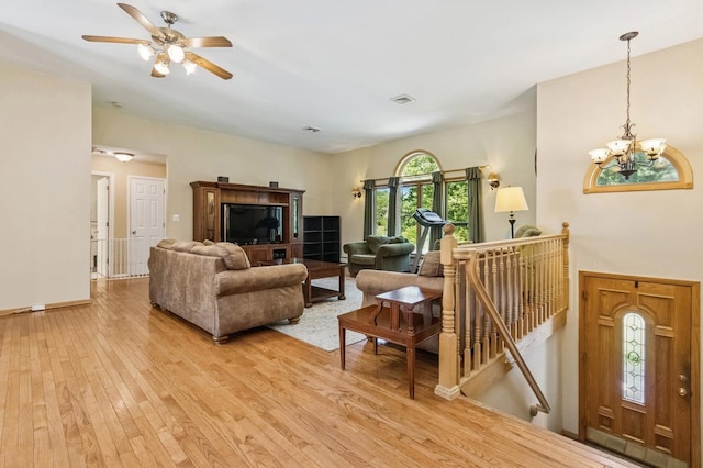 312 Diddell Rd, Poughkeepsie, NY 12603 - living room featuring light wood-type flooring, a chandelier, a ceiling fan, and baseboards