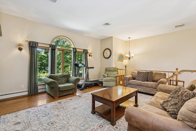 312 Diddell Rd, Poughkeepsie, NY 12603 - living area featuring wood finished floors and a chandelier