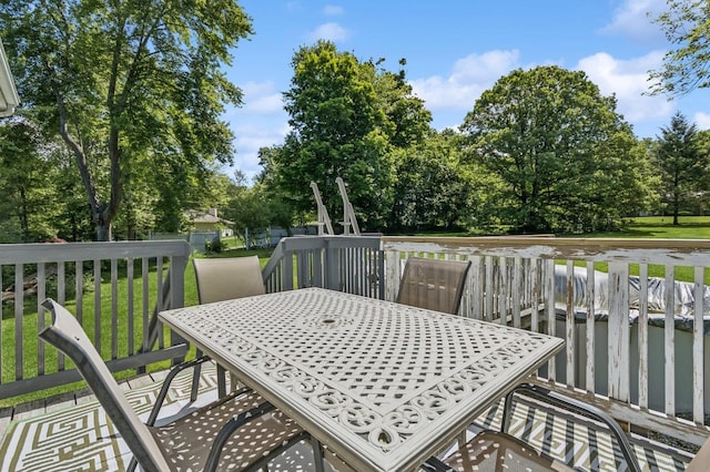312 Diddell Rd, Poughkeepsie, NY 12603 - wooden terrace with outdoor dining space, a yard, and view of scattered trees