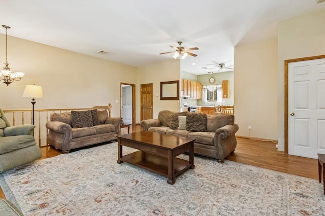 312 Diddell Rd, Poughkeepsie, NY 12603 - living room featuring wood finished floors, ceiling fan, and a chandelier