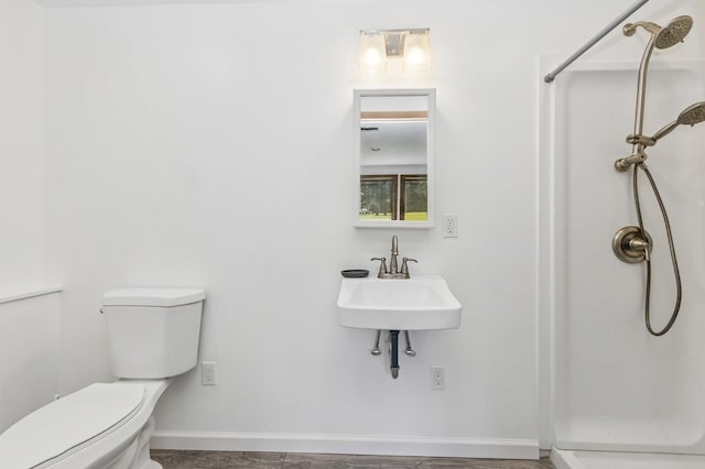 312 Diddell Rd, Poughkeepsie, NY 12603 - bathroom with a shower stall, toilet, a sink, and baseboards