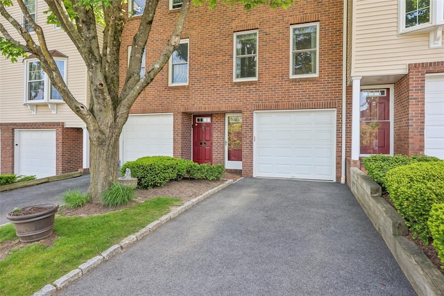 7 Washington Mews Unit 7, Port Chester, NY 10573 - multi unit property with an attached garage, asphalt driveway, and brick siding