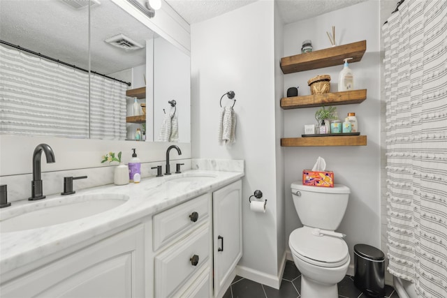 7 Washington Mews Unit 7, Port Chester, NY 10573 - bathroom featuring double vanity, a textured ceiling, tile patterned floors, and curtained shower