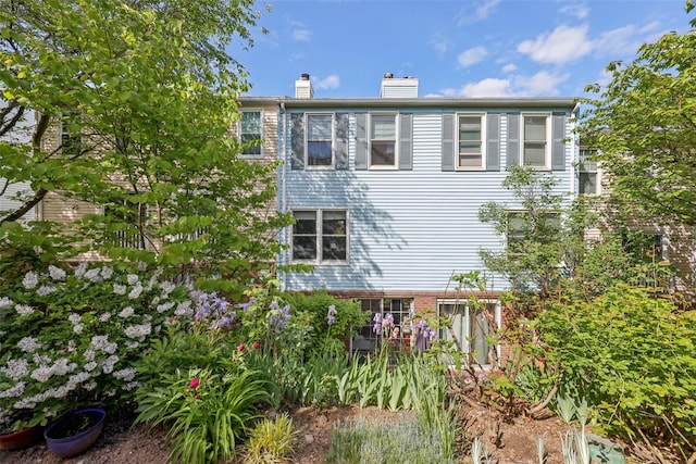 7 Washington Mews Unit 7, Port Chester, NY 10573 - view of home's exterior featuring a chimney and brick siding