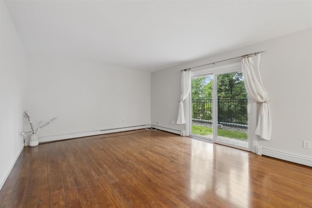 12 Scenic Dr Unit T, Croton-On-Hudson, NY 10520 - spare room with wood finished floors, a baseboard heating unit, and baseboards