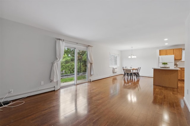 12 Scenic Dr Unit T, Croton-On-Hudson, NY 10520 - living area featuring a chandelier, wood finished floors, baseboard heating, recessed lighting, and baseboards