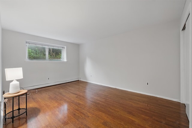 12 Scenic Dr Unit T, Croton-On-Hudson, NY 10520 - spare room with a baseboard radiator, wood finished floors, and baseboards