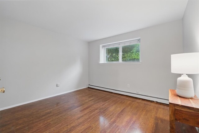 12 Scenic Dr Unit T, Croton-On-Hudson, NY 10520 - unfurnished room with a baseboard radiator, wood finished floors, and baseboards