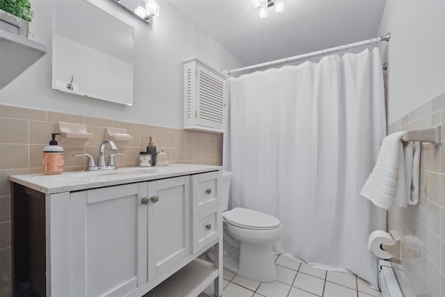 12 Scenic Dr Unit T, Croton-On-Hudson, NY 10520 - full bath featuring tile walls, tile patterned floors, toilet, vanity, and a baseboard radiator