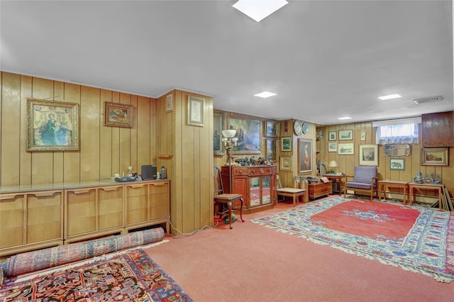 207 N 3rd St, Bethpage, NY 11714 - living area featuring carpet floors and wood walls