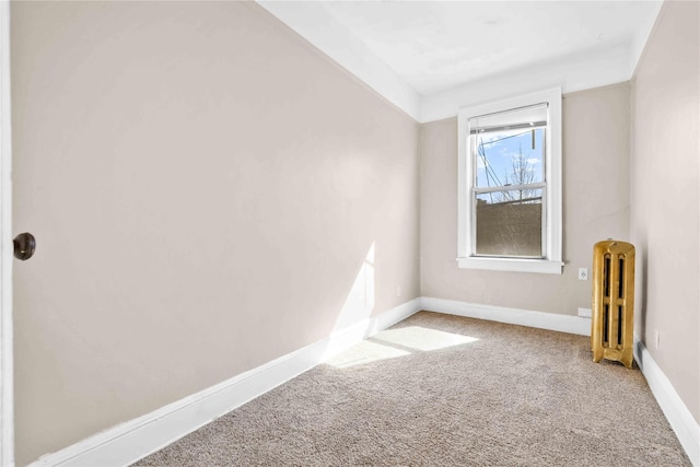 3004 14th St, Astoria, NY 11102 - carpeted spare room featuring radiator heating unit and baseboards
