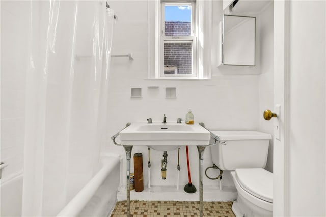 3004 14th St, Astoria, NY 11102 - bathroom featuring toilet, shower / bath combo with shower curtain, and a sink