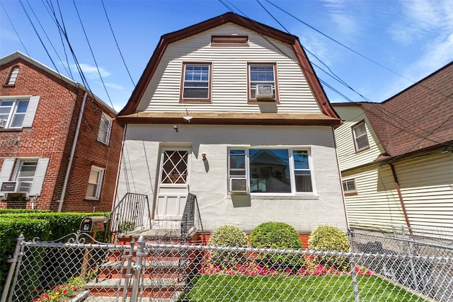 4 Oakley Pl, Mount Vernon, NY 10550 - colonial inspired home with a gambrel roof, a fenced front yard, and cooling unit