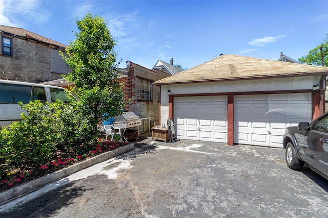 4 Oakley Pl, Mount Vernon, NY 10550 - view of front of house featuring a garage and a shingled roof
