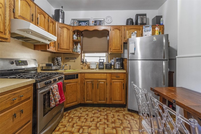 4 Oakley Pl, Mount Vernon, NY 10550 - kitchen with appliances with stainless steel finishes, under cabinet range hood, brown cabinets, and light countertops