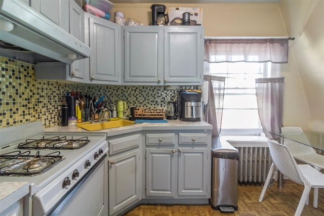 4 Oakley Pl, Mount Vernon, NY 10550 - kitchen with stove, under cabinet range hood, gray cabinetry, and light countertops