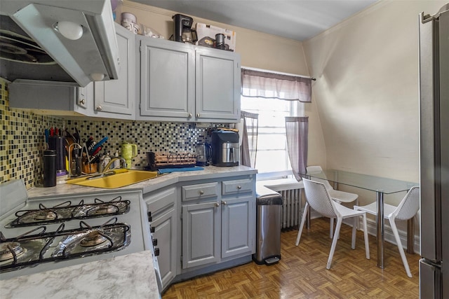 4 Oakley Pl, Mount Vernon, NY 10550 - kitchen featuring range with gas cooktop, light countertops, gray cabinets, backsplash, and crown molding