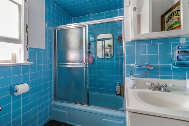 4 Oakley Pl, Mount Vernon, NY 10550 - bathroom with tile walls, vanity, and bath / shower combo with glass door
