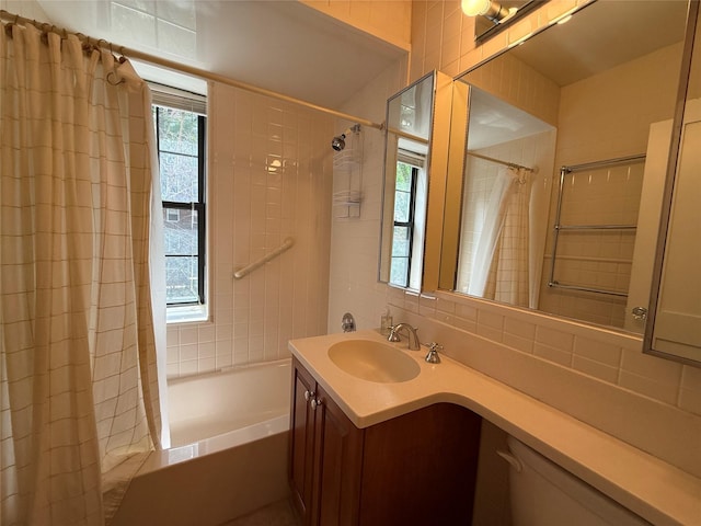 198 Garth Rd Unit 1D, Scarsdale, NY 10583 - full bathroom featuring shower / bath combo with shower curtain, vanity, and backsplash
