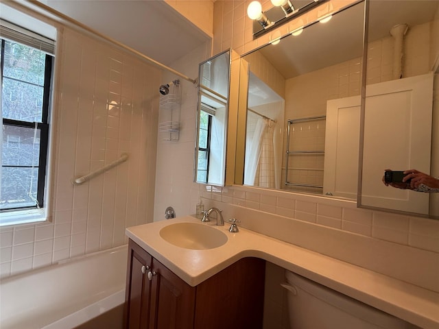 198 Garth Rd Unit 1D, Scarsdale, NY 10583 - bathroom with tasteful backsplash, vanity, and shower / bath combo