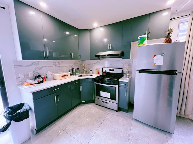 94-30 50th Ave, Elmhurst, NY 11373 - kitchen with stainless steel appliances, under cabinet range hood, light countertops, backsplash, and a sink