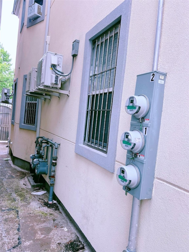 94-30 50th Ave, Elmhurst, NY 11373 - exterior view of electric meter, stucco siding, and gas meter