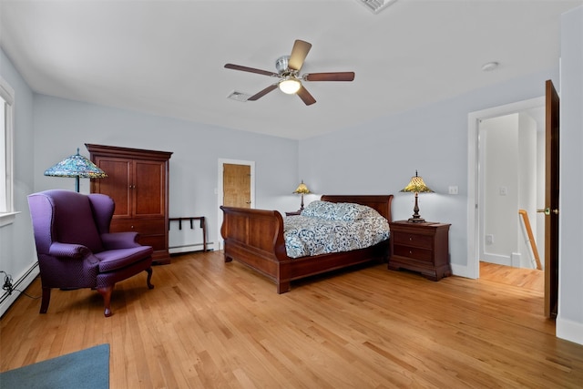 138 Jansen, Holmes, NY 12531 - bedroom featuring a baseboard heating unit, light wood finished floors, and a ceiling fan