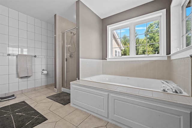 138 Jansen, Holmes, NY 12531 - bathroom with a stall shower, tile patterned floors, a garden tub, healthy amount of natural light, and tile walls