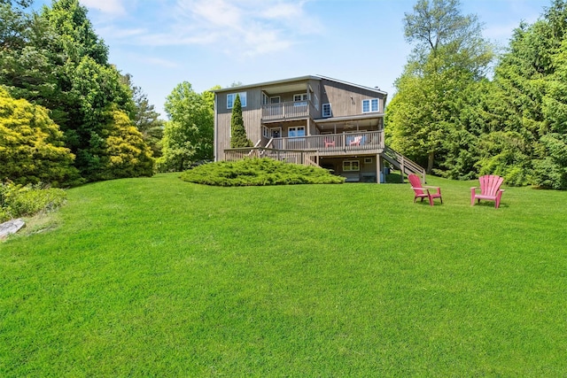 138 Jansen, Holmes, NY 12531 - rear view of house with stairs, a lawn, a wooden deck, and a balcony