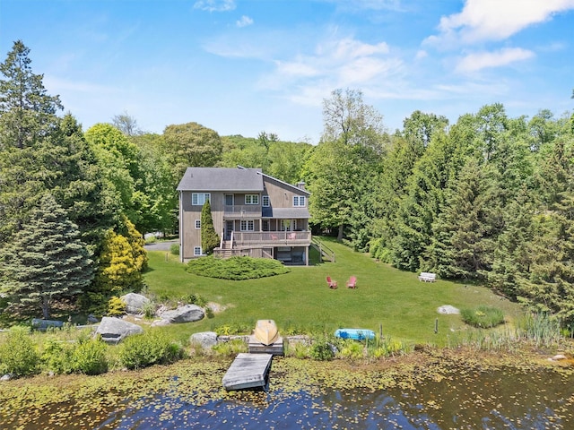 138 Jansen, Holmes, NY 12531 - back of property with a lawn, a deck, and a view of trees