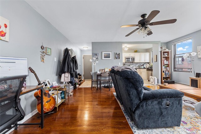 1 Jefferson Ave Unit B12, Rockville Centre, NY 11570 - living area with wood finished floors, ceiling fan, and baseboards
