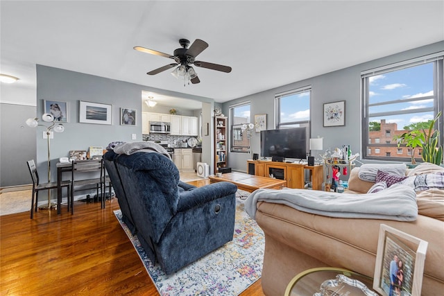 1 Jefferson Ave Unit B12, Rockville Centre, NY 11570 - living area featuring wood finished floors and a ceiling fan