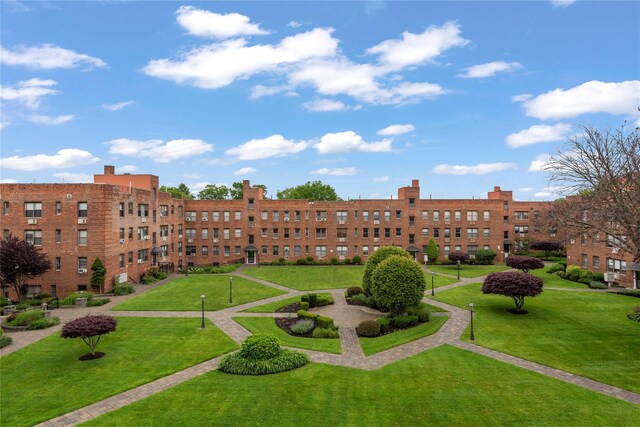 1 Jefferson Ave Unit B12, Rockville Centre, NY 11570 - view of community with a lawn