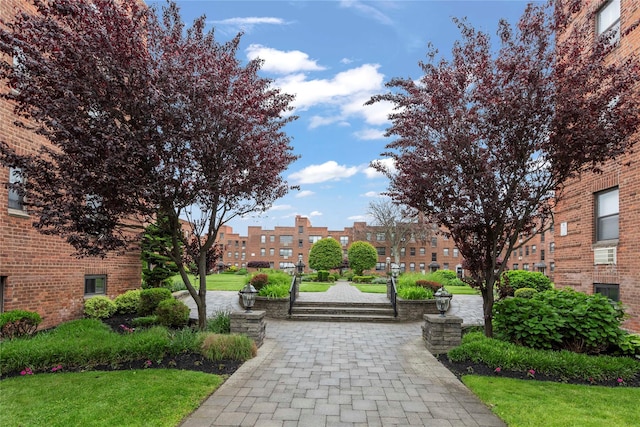 1 Jefferson Ave Unit B12, Rockville Centre, NY 11570 - surrounding community featuring a lawn