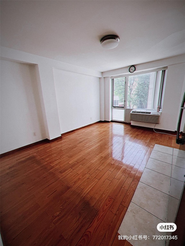 139-30 34th Ave Unit 3B, Flushing, NY 11355 - unfurnished room with hardwood / wood-style flooring and a wall mounted air conditioner
