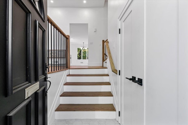 311 Hungry Harbor Rd, North Woodmere, NY 11581 - stairway with recessed lighting and a chandelier