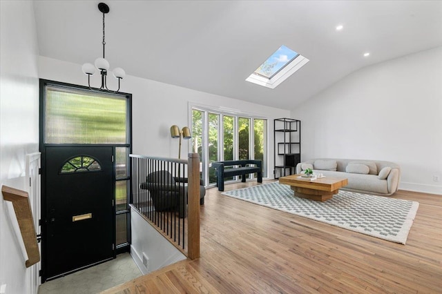 311 Hungry Harbor Rd, North Woodmere, NY 11581 - entryway with lofted ceiling, a skylight, wood finished floors, a chandelier, and recessed lighting