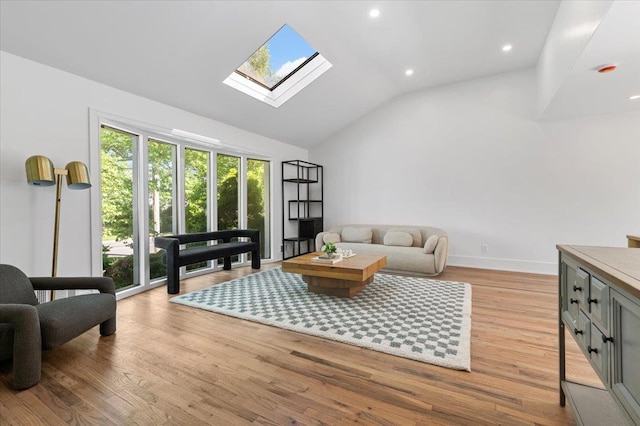 311 Hungry Harbor Rd, North Woodmere, NY 11581 - living area featuring a skylight, healthy amount of natural light, light wood-style flooring, recessed lighting, and high vaulted ceiling