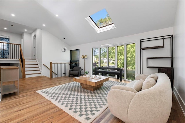 311 Hungry Harbor Rd, North Woodmere, NY 11581 - living room featuring lofted ceiling, light wood-type flooring, a skylight, and recessed lighting